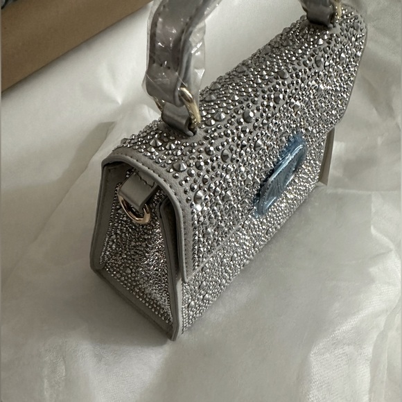 Handbags - Beautiful purse , shining, silver color. New with tag!!